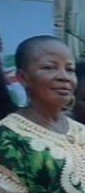 Happy African woman beneficiary smiling after receiving support